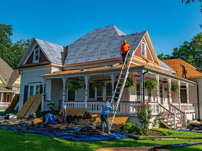 workers providing roof installation