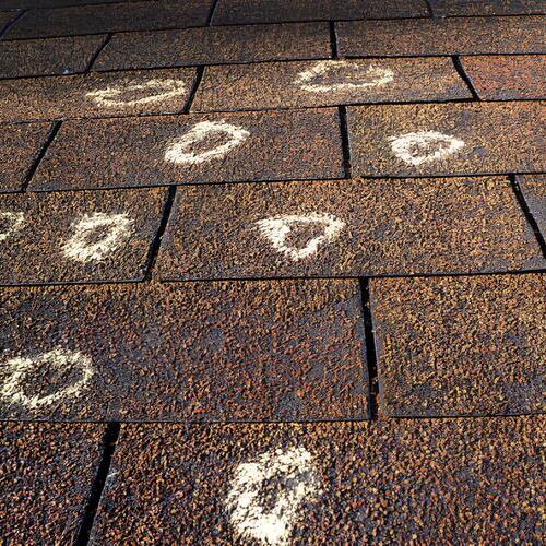 marks on a hail damaged roof