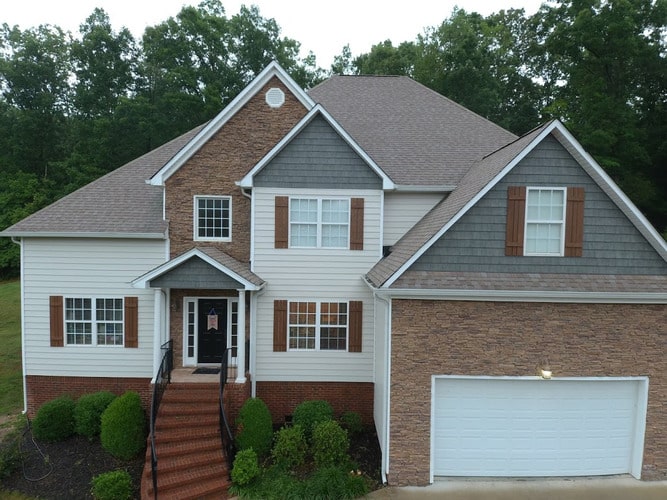 home with a shingle roofing system